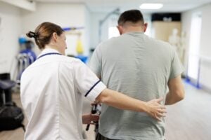 A Brainkind Healthcare assistant with a person we support.