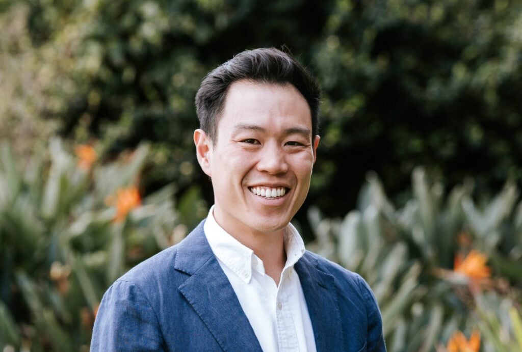 Picture of trustee David Chang in a blue suit